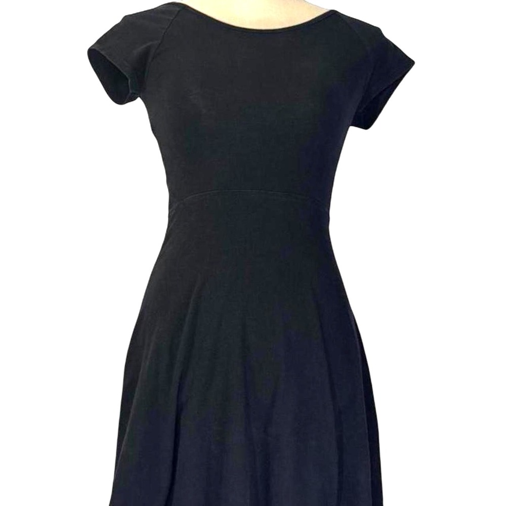 Soffe black mini skater dress featuring a chic cross-back strap design